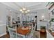 Open dining area with hardwood floors seamlessly connects to the living room at 17 Denny Springs Dr, Dallas, GA 30157