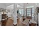 Elegant dining room with wainscoting, hardwood floors, and natural light creates a warm ambiance at 17 Denny Springs Dr, Dallas, GA 30157