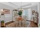 Elegant dining room with decorative chandelier, hardwood floors, and ample natural light at 17 Denny Springs Dr, Dallas, GA 30157
