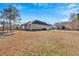View of single-Gathering home with neutral siding and vast front lawn at 17 Denny Springs Dr, Dallas, GA 30157
