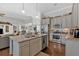Open concept kitchen with stainless steel appliances, central island and hardwood floors at 17 Denny Springs Dr, Dallas, GA 30157