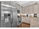 Modern kitchen featuring stainless steel appliances and granite countertops with hardwood flooring at 17 Denny Springs Dr, Dallas, GA 30157
