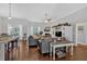 Open living room featuring hardwood floors, neutral walls, and seamless flow to the dining area at 17 Denny Springs Dr, Dallas, GA 30157