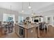 Open-concept kitchen and living room featuring granite countertops and hardwood floors at 17 Denny Springs Dr, Dallas, GA 30157