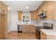 Modern kitchen features stainless steel appliances, white countertops, and wood cabinets at 2260 Old Spring Se Rd, Smyrna, GA 30080