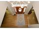 View of front door with decorative glass, hardwood floors, decorative area rug, and light-filled foyer at 4014 Ironhill Ln, Woodstock, GA 30189