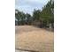 Large private backyard with mature trees and a wooden fence at 1366 Image Xing, Lawrenceville, GA 30045