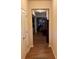 Hallway leading to the living area with hardwood floors and neutral paint at 1366 Image Xing, Lawrenceville, GA 30045