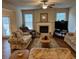 Spacious living room includes a fireplace, ample natural light, and neutral décor at 1366 Image Xing, Lawrenceville, GA 30045