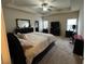 Main bedroom with plush carpeting, a ceiling fan, and ample space at 1366 Image Xing, Lawrenceville, GA 30045