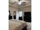 This spacious main bedroom features a ceiling fan and a view of the ensuite bathroom at 1366 Image Xing, Lawrenceville, GA 30045