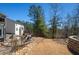 Expansive backyard with a patio, fire pit, and landscaped accents, providing a serene and private outdoor retreat at 139 Stargaze Rdg, Canton, GA 30114