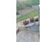 The backyard features a tiered garden with stone retaining walls and greenery at 139 Stargaze Rdg, Canton, GA 30114