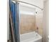 Bright bathroom featuring a white tub, decorative curtain, tiled walls, and modern shower head at 139 Stargaze Rdg, Canton, GA 30114