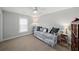 Neutral bedroom featuring plush carpet, a cozy window seat, and soothing decor at 139 Stargaze Rdg, Canton, GA 30114