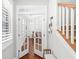 Elegant entryway with glass French doors and hardwood floors with a glimpse of the staircase at 139 Stargaze Rdg, Canton, GA 30114