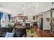 Open-concept kitchen and living area with hardwood floors, stainless steel appliances, and a large island with seating at 139 Stargaze Rdg, Canton, GA 30114