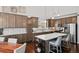 Well-appointed kitchen featuring hardwood floors, stainless steel appliances, a large island, and elegant cabinetry at 139 Stargaze Rdg, Canton, GA 30114