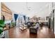 Bright living room featuring a fireplace, wood accent wall, and modern decor, seamlessly flowing into the open kitchen at 139 Stargaze Rdg, Canton, GA 30114