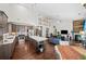 Open concept living space features an island kitchen, a barn door pantry, and living room with fireplace at 139 Stargaze Rdg, Canton, GA 30114