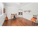 Home office with hardwood floors, wainscoting, and a vintage desk with a black chair at 139 Stargaze Rdg, Canton, GA 30114