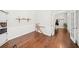 Another angle of the stylish home office featuring hardwood floors, and ample natural light from nearby french doors at 139 Stargaze Rdg, Canton, GA 30114