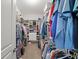 Well-organized walk-in closet features ample hanging space and shelving for clothing and accessories at 139 Stargaze Rdg, Canton, GA 30114