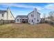 A spacious backyard featuring a wooden deck and privacy fence at 4439 Persian Ct, Snellville, GA 30039