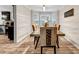 A dining room featuring natural light from a bay window and a long table with decorative chairs at 4439 Persian Ct, Snellville, GA 30039