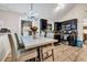 Bright kitchen featuring stainless steel appliances, dark cabinetry, and a dining area with modern lighting at 4439 Persian Ct, Snellville, GA 30039