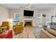 Bright living room featuring a fireplace, comfortable seating, and natural light from the windows at 4439 Persian Ct, Snellville, GA 30039