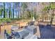 Inviting outdoor deck with wicker seating, wrought iron chairs, and a gas grill provides a relaxing entertaining area at 1434 Blackland Trl, Lawrenceville, GA 30043