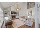 Comfortable living room featuring a stone fireplace, built-in shelving, and plenty of natural light at 1434 Blackland Trl, Lawrenceville, GA 30043