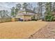Large backyard with an expansive lawn, a covered patio, and mature trees at 2998 Octavia Cir, Marietta, GA 30062