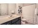 Full bathroom with a large vanity, decorative plates and shower with white shower curtain at 2998 Octavia Cir, Marietta, GA 30062