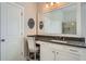 Bathroom vanity with a large mirror, granite countertops, and a makeup area with a stool at 2998 Octavia Cir, Marietta, GA 30062