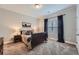 Cozy bedroom featuring plush carpet, a dark wood bed frame, and natural light through the window at 2998 Octavia Cir, Marietta, GA 30062