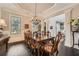 Spacious dining room with hardwood floors, crown molding, and large windows at 2998 Octavia Cir, Marietta, GA 30062