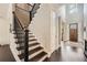Grand entryway with a wooden front door, staircase with iron railings, and hardwood flooring at 2998 Octavia Cir, Marietta, GA 30062