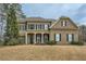 Traditional two-story brick home with a manicured lawn and symmetrical design at 2998 Octavia Cir, Marietta, GA 30062