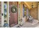 Charming porch area featuring brick flooring, outdoor seating, and decorative lanterns at 2998 Octavia Cir, Marietta, GA 30062