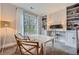 Bright home office featuring custom built-ins, modern lighting, and large window with wooded views at 2998 Octavia Cir, Marietta, GA 30062