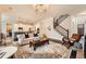 Spacious living room with open kitchen, staircase, and lots of natural light at 2998 Octavia Cir, Marietta, GA 30062