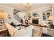Inviting living room with fireplace, staircase, and elegant décor at 2998 Octavia Cir, Marietta, GA 30062