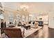 Open-concept living room showcasing elegant furnishings, fireplace, and seamless flow to the kitchen at 2998 Octavia Cir, Marietta, GA 30062