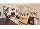 Cozy living room featuring a brick fireplace, custom built-ins, and lots of natural light at 2998 Octavia Cir, Marietta, GA 30062