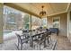 Outdoor dining area with comfortable seating, covered patio, and views of the backyard pool area at 2998 Octavia Cir, Marietta, GA 30062