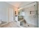 Large walk-in shower with bench, rain shower head and neutral color tile at 2998 Octavia Cir, Marietta, GA 30062