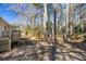 A spacious backyard surrounded by tall trees, offering privacy and a connection with nature at 3687 Venus Nw Pl, Atlanta, GA 30331