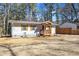 Well-maintained single-story house with light-colored facade, neat landscaping, and wooden shutters at 3687 Venus Nw Pl, Atlanta, GA 30331